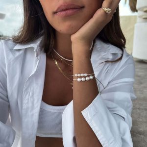 Model wearing the Ariel Bracelet with freshwater pearls, showcasing an effortless style.