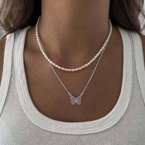 Emily Necklace - 925 Sterling Silver featuring delicate freshwater pearls and a butterfly pendant.