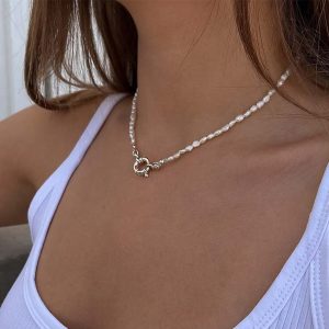 Kendall Necklace - 925 Sterling Silver worn by model featuring elegant pearls and a front-toggle clasp.