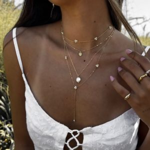 Lily Necklace featuring layers of 14K gold plated brass with EuroCrystal pearls, perfect for a chic summer look.