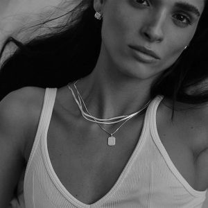 Model wearing the Maayan Necklace Set, showcasing layered delicate necklaces for a trendy statement look.