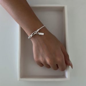 Mali Bracelet - 925 Sterling Silver displayed on a hand, showcasing its delicate woven chain design.