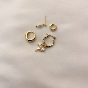 Monaco Earring set featuring 5 unique earrings in gold with pearls for a bold asymmetrical look.