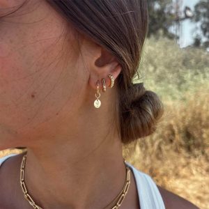 Wheat Earrings showcased on a model, featuring delicate hoops and a hand-engraved wheat charm.