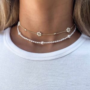 Close-up of the elegant Yuli Necklace, handwoven with crystal pearls, perfect for layering in spring.